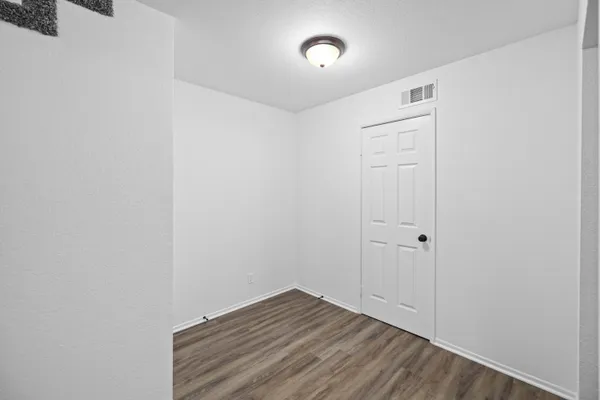 a view of small space with wooden floor