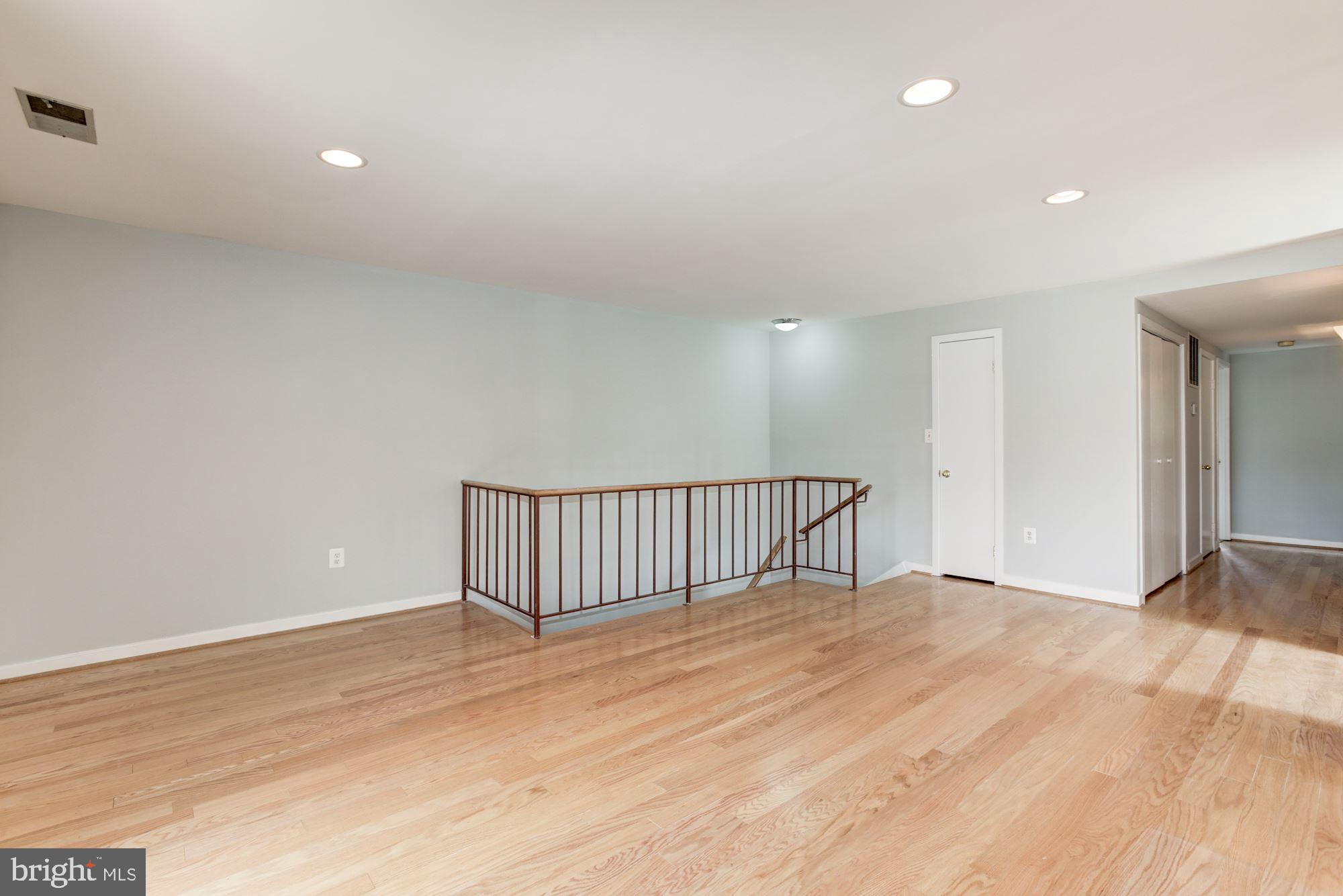 425 South Sharp Street, Unit R15 Baltimore, MD 21201 - Photo 12 of 40 Stairs and Bedroom hallway visible, Kitchen on R