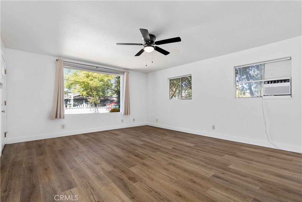 317 Crocker Street Templeton, CA 93465 - Photo 10 of 36 a view of empty room with wooden floor and fan