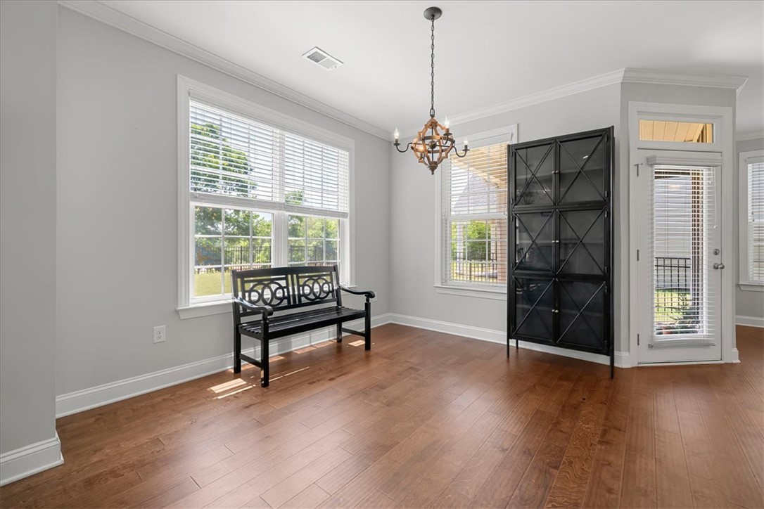 21 Barron Glenn Way Anderson, SC 29621 - Photo 17 of 48 This airy Dining room features rich hardwood flooring, multiple windows for natural light, and elegant crown molding.