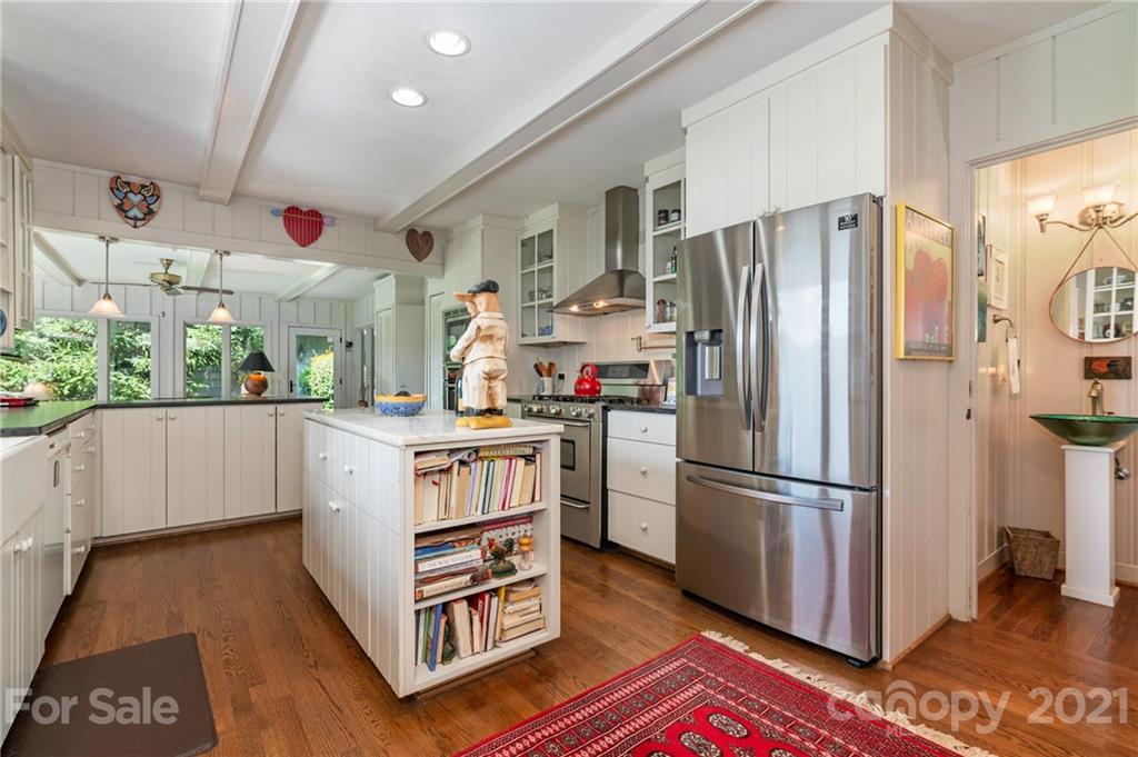 811 Hunting Country Road Tryon, NC 28782 - Photo 11 of 40 a kitchen with stainless steel appliances a refrigerator and a stove
