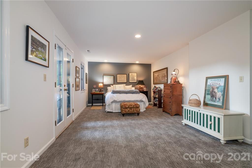 811 Hunting Country Road Tryon, NC 28782 - Photo 24 of 40 a bedroom with furniture and a window