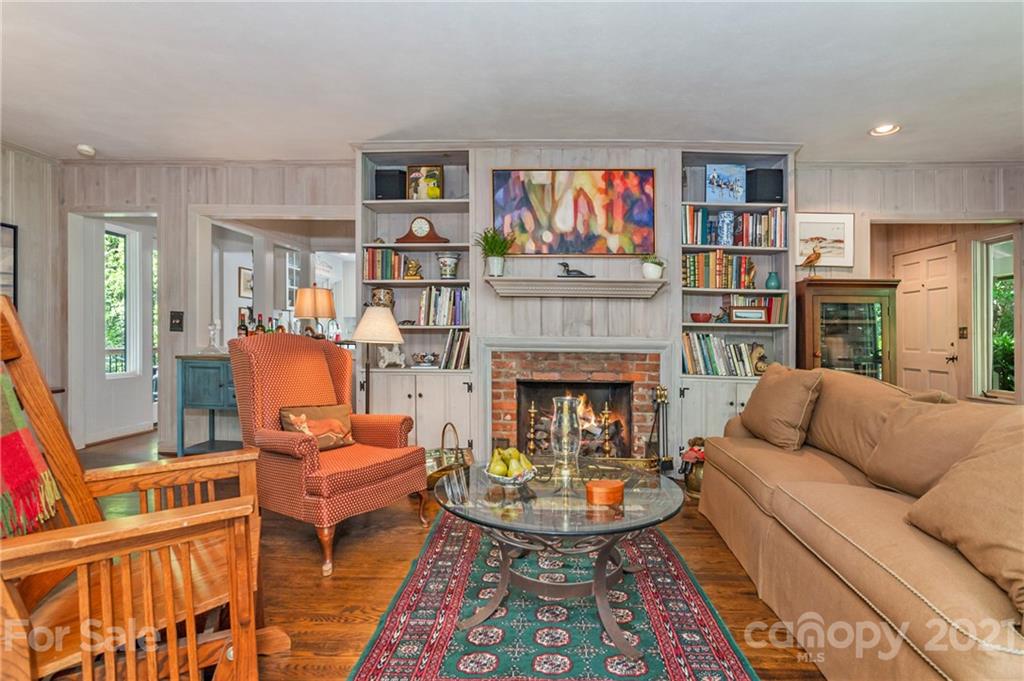 811 Hunting Country Road Tryon, NC 28782 - Photo 7 of 40 a living room with furniture and a fireplace
