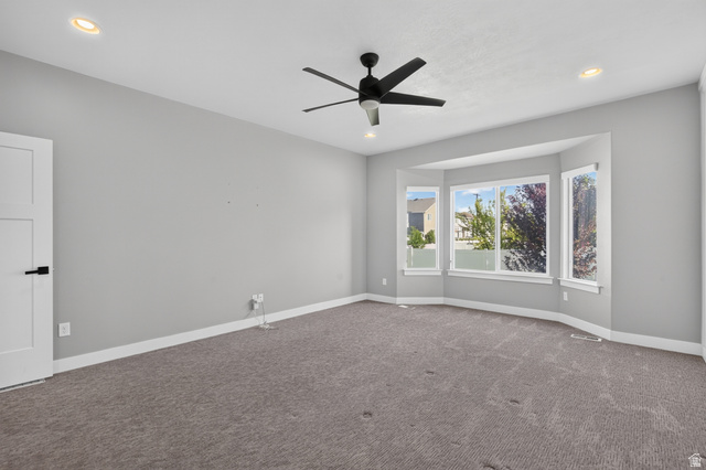 36 West Syracuse Road Vineyard, UT 84059 - Photo 25 of 56 Spacious room featuring a bay window, recessed lighting, and a contemporary ceiling fan