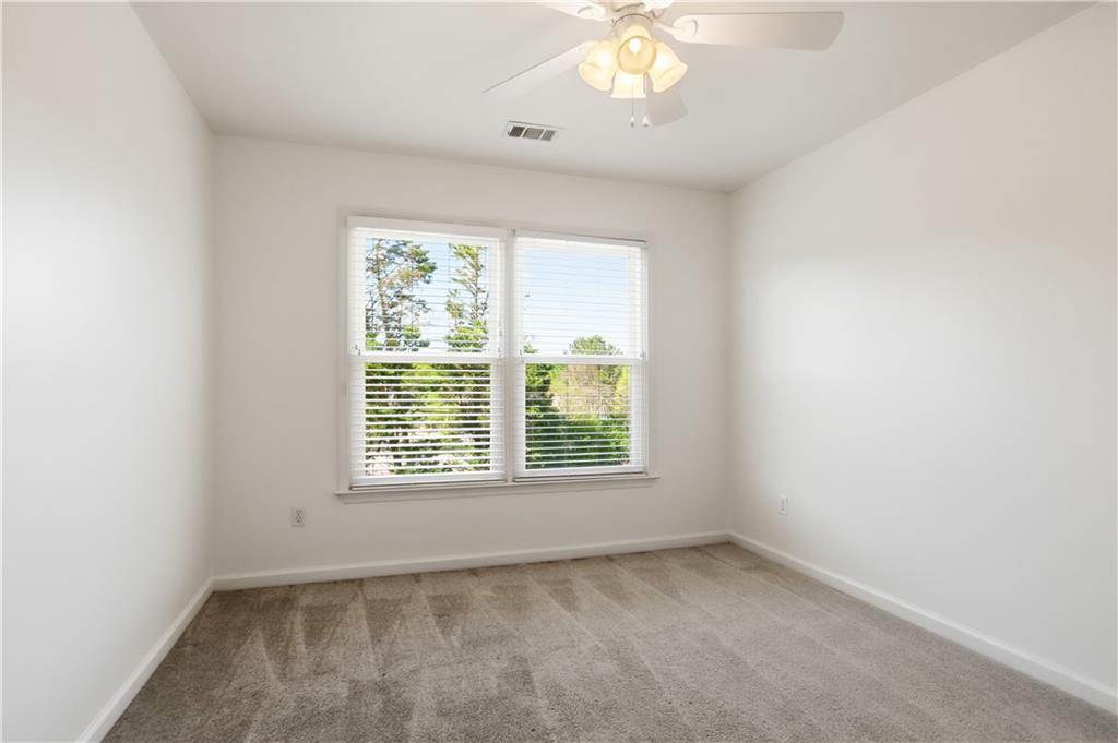 7770 Llangollen Way Cumming, GA 30041 - Photo 26 of 44 an empty room with a window