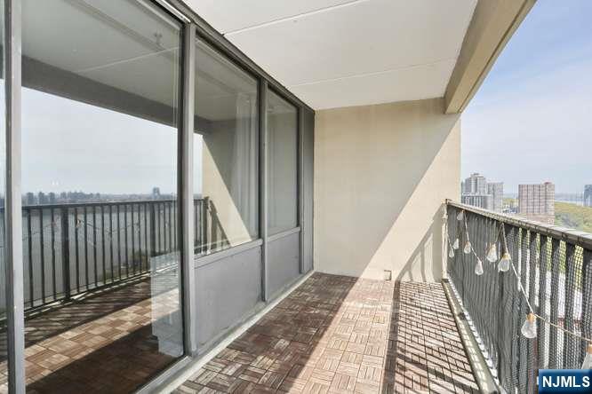 6 Horizon Road, Unit 2405 Fort Lee, NJ 07024 - Photo 3 of 42 a view of balcony with wooden floor