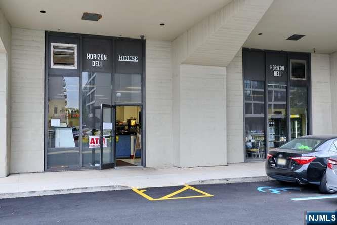 6 Horizon Road, Unit 2405 Fort Lee, NJ 07024 - Photo 41 of 42 a view of car parked in front of building