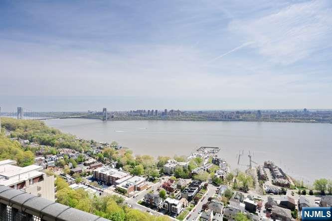6 Horizon Road, Unit 2405 Fort Lee, NJ 07024 - Photo 5 of 42 a view of a lake with a city