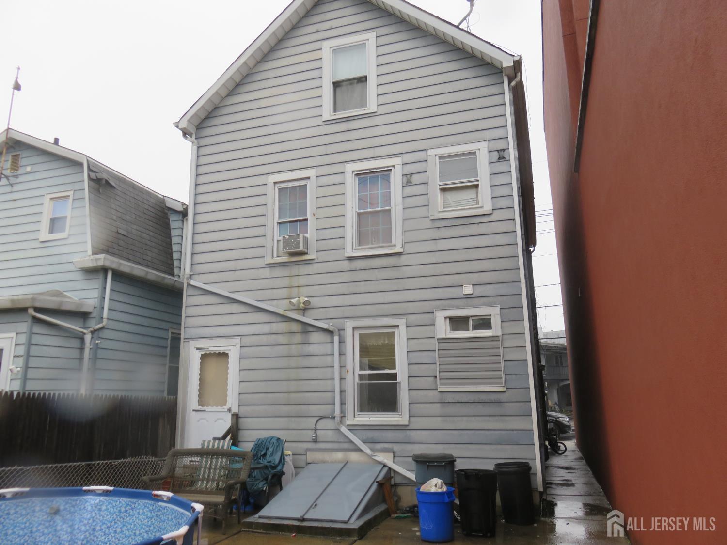 715 State Street Perth Amboy, NJ 08861 - Photo 12 of 13 a view of a house with a patio