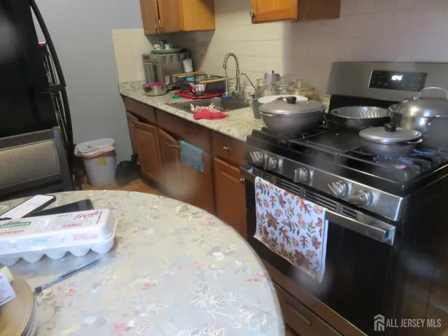 a kitchen with a stove and a sink