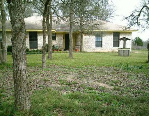 20408 Lockwood Road Manor, TX 78653 - Photo 1 of 1 a view of a house with yard and a tree
