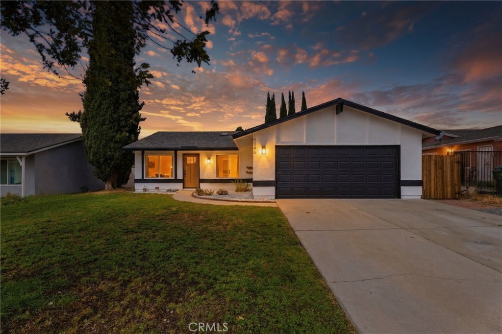 10046 Tudor Avenue Montclair, CA 91763 - Photo 1 of 1 a front view of a house with a yard and garage
