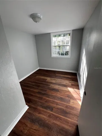 a view of an empty room and window