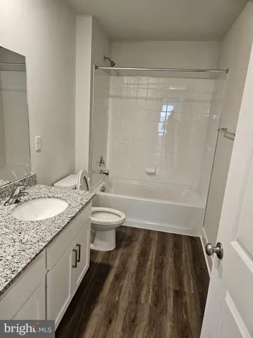 a bathroom with a shower and a toilet