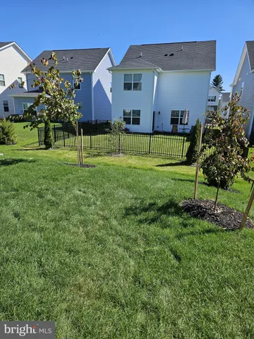 a front view of a house with parking space