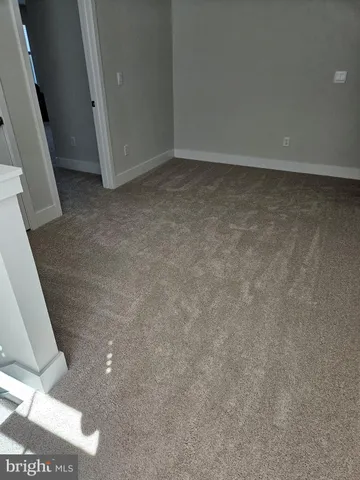 a view of a house with a big yard and potted plants