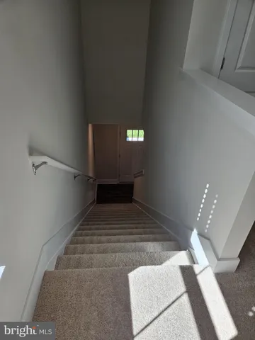 a large kitchen with granite countertop a stove a sink and a granite counter top