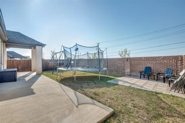 a view of swimming pool with outdoor seating