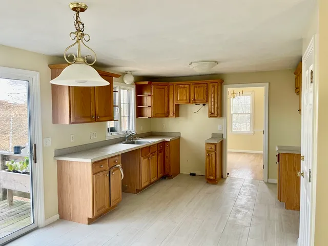 a kitchen with a sink stove and cabinets