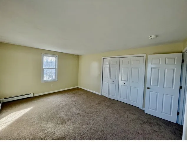 an empty room with a empty space and windows