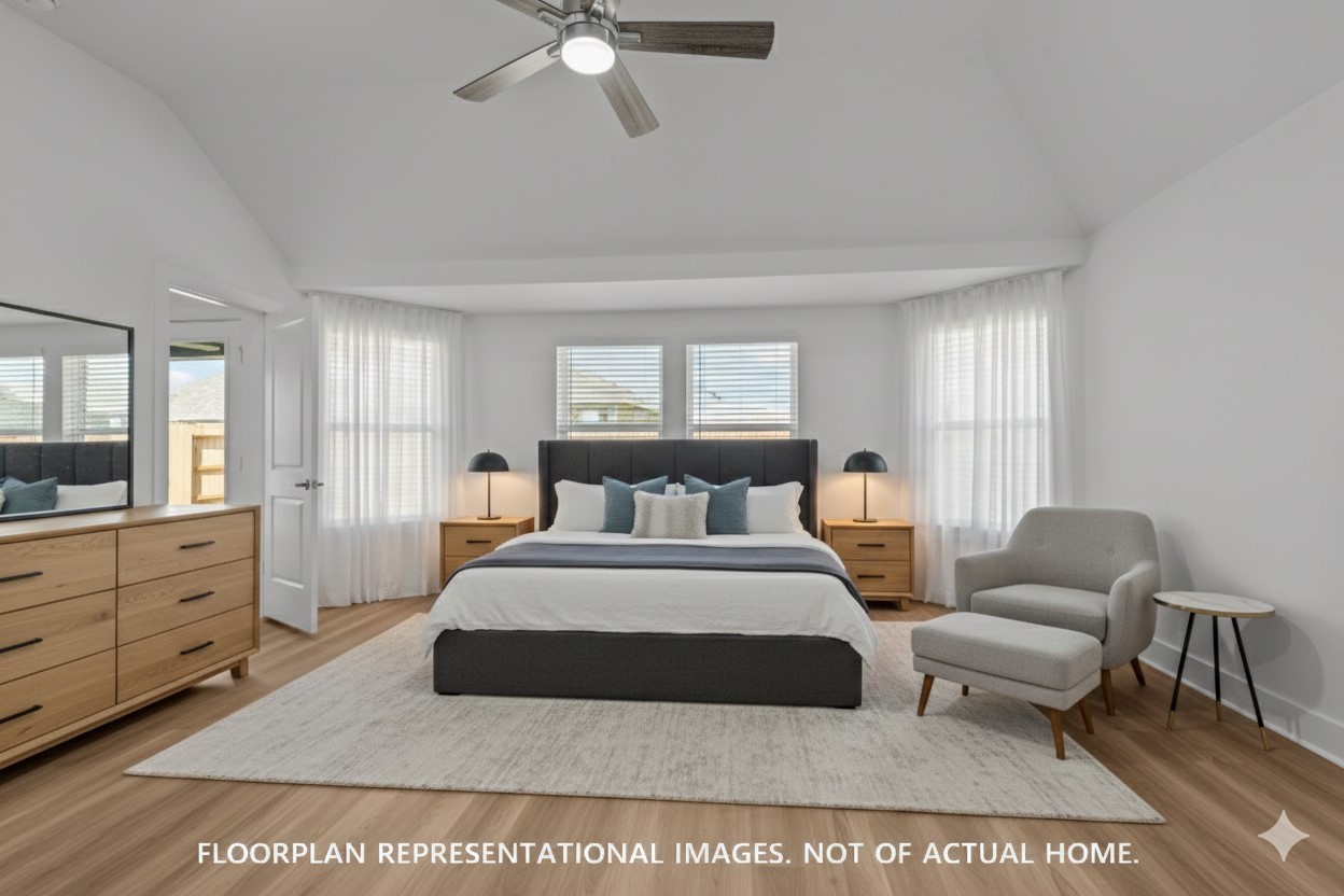 2119 Lone Bronco Boulevard Rosenberg, TX 77471 - Photo 10 of 12 a spacious bedroom with a large bed and a chandelier