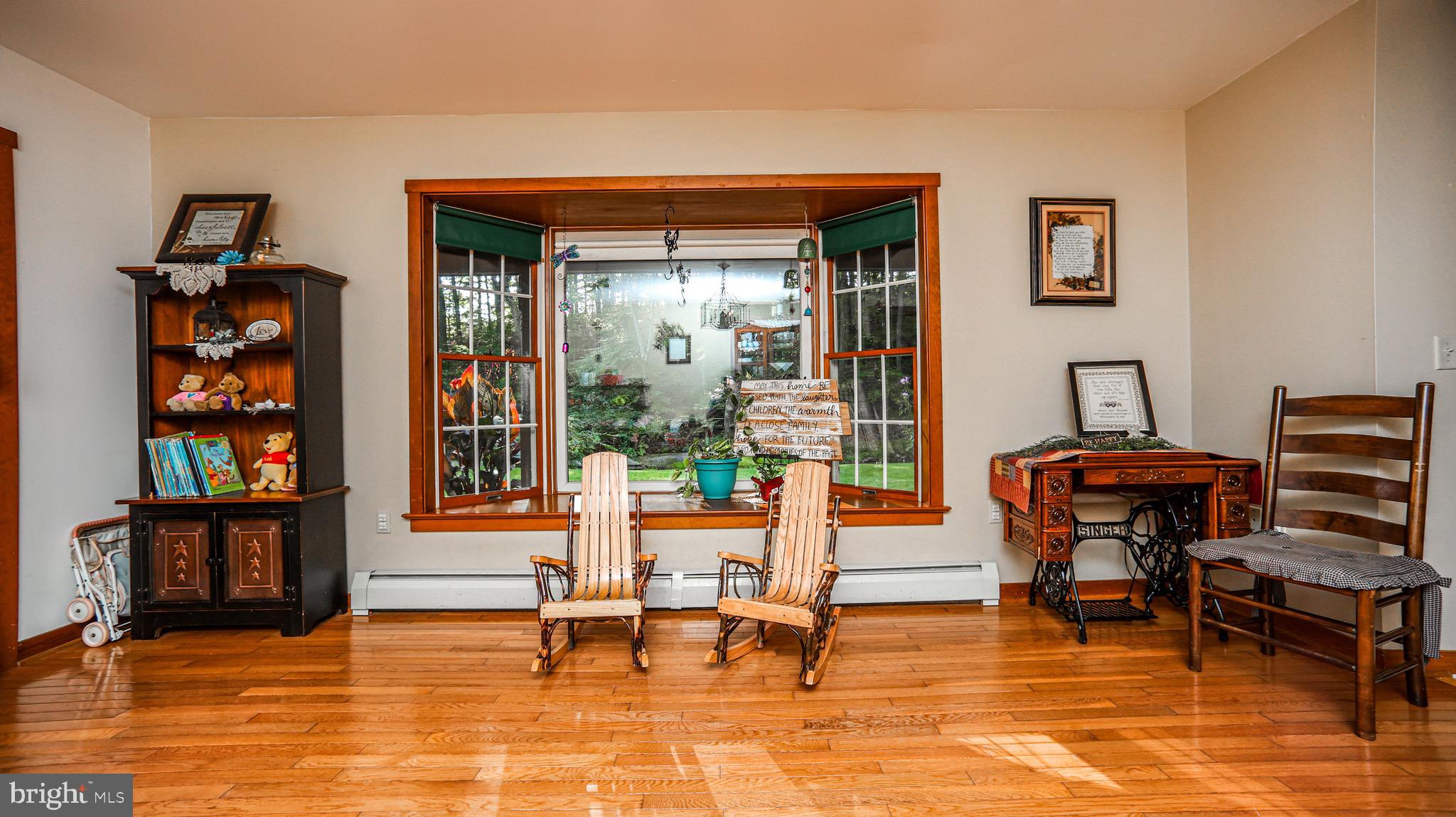 240 Evans Road Lititz, PA 17543 - Photo 15 of 77 a living room with furniture and a book shelf