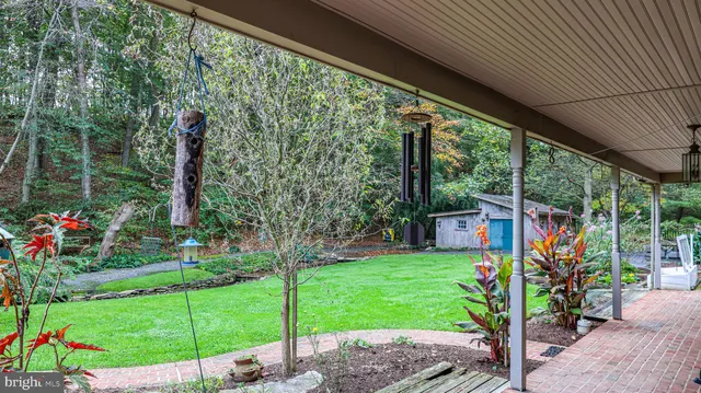 a bathroom with a sink a toilet and shower curtain