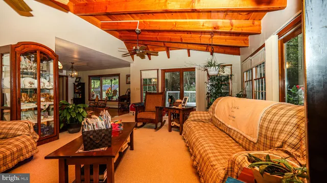 a bathroom with a sink a toilet and shower curtain