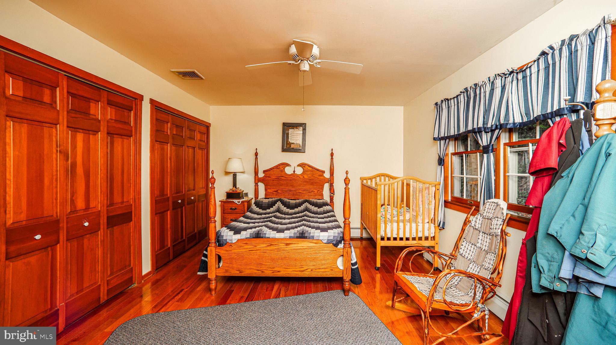 240 Evans Road Lititz, PA 17543 - Photo 23 of 77 a bedroom with furniture and a book shelf