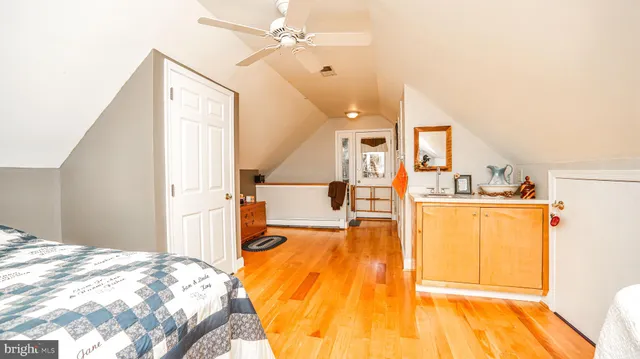 a view of a livingroom with furniture and a ceiling fan