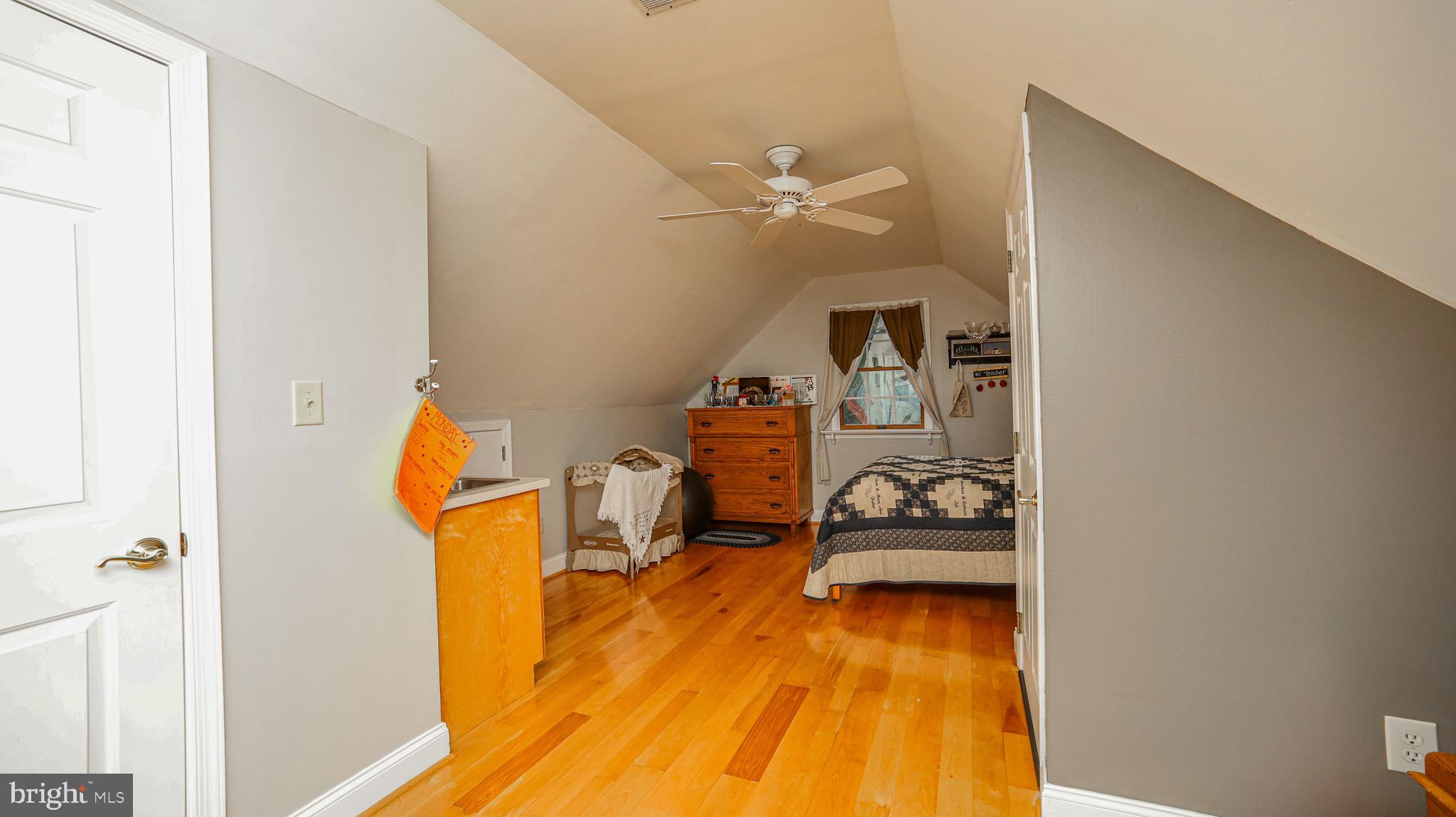 240 Evans Road Lititz, PA 17543 - Photo 32 of 77 a bedroom with a bed and wooden floor