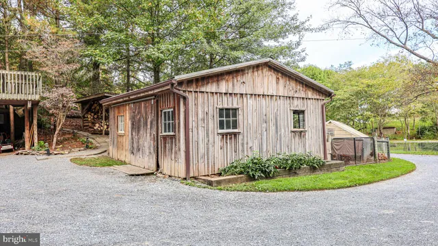 a front view of a house with garden and porch