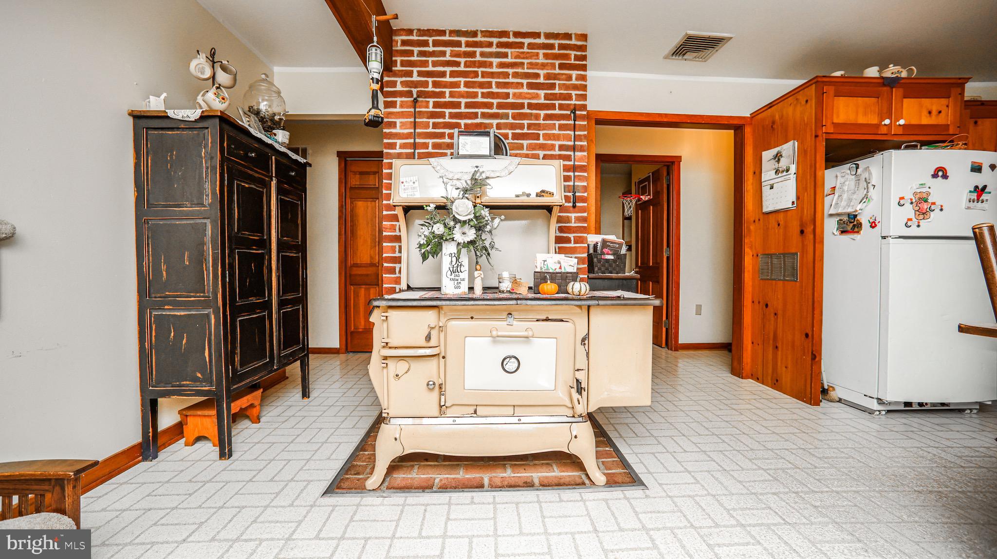 240 Evans Road Lititz, PA 17543 - Photo 4 of 77 a living room with stainless steel appliances furniture a chandelier and a dining table view