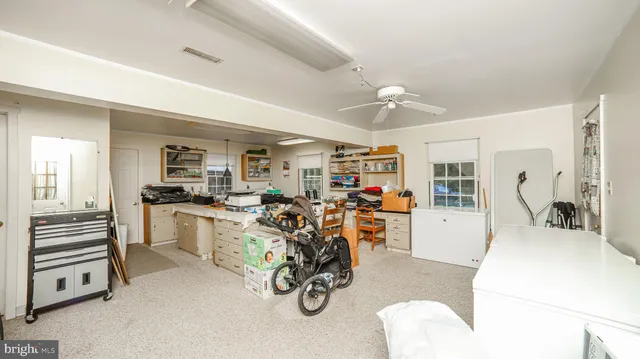 a view of a chair and fire pit in the garden