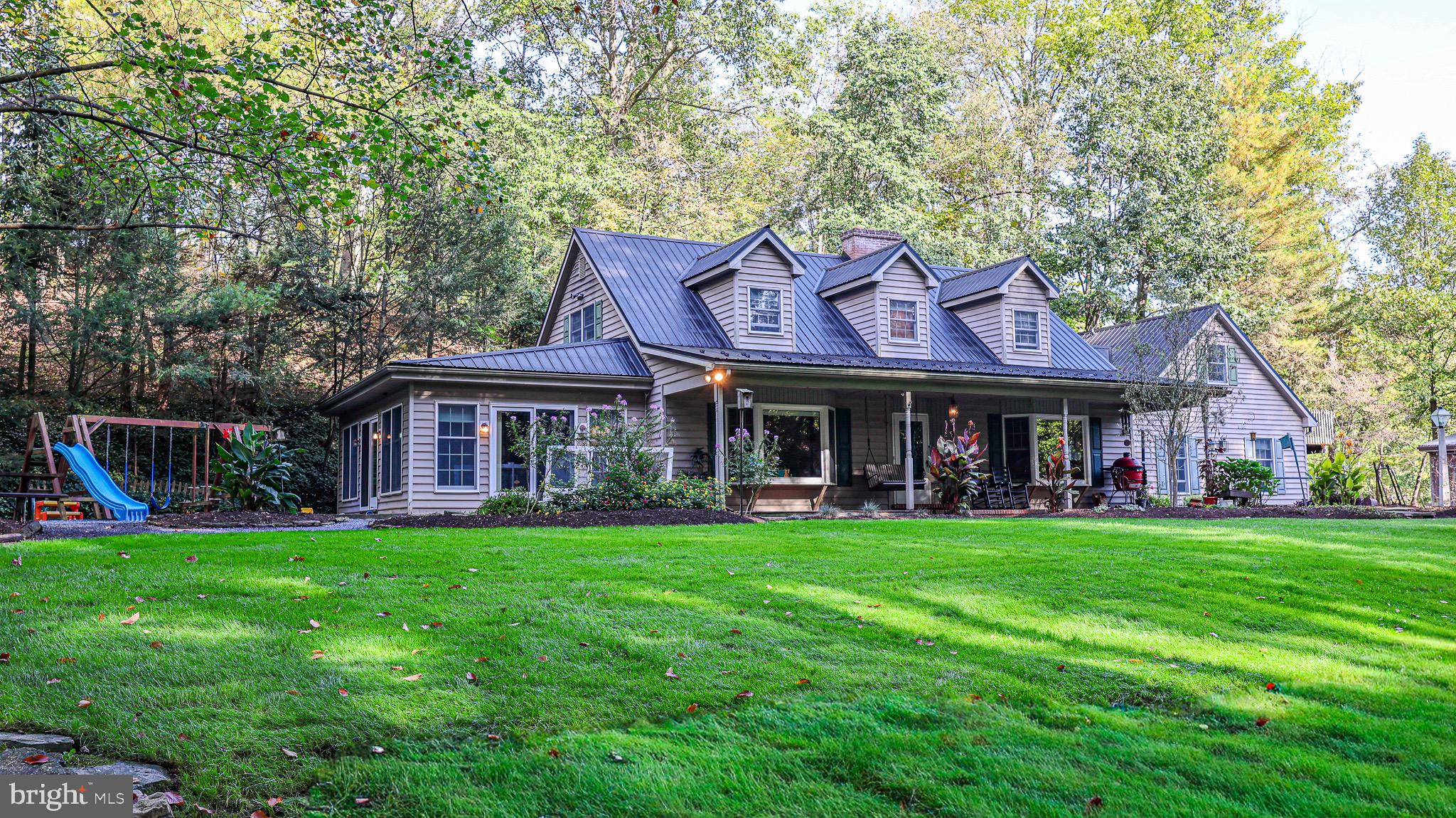 240 Evans Road Lititz, PA 17543 - Photo 48 of 77 a front view of a house with a garden