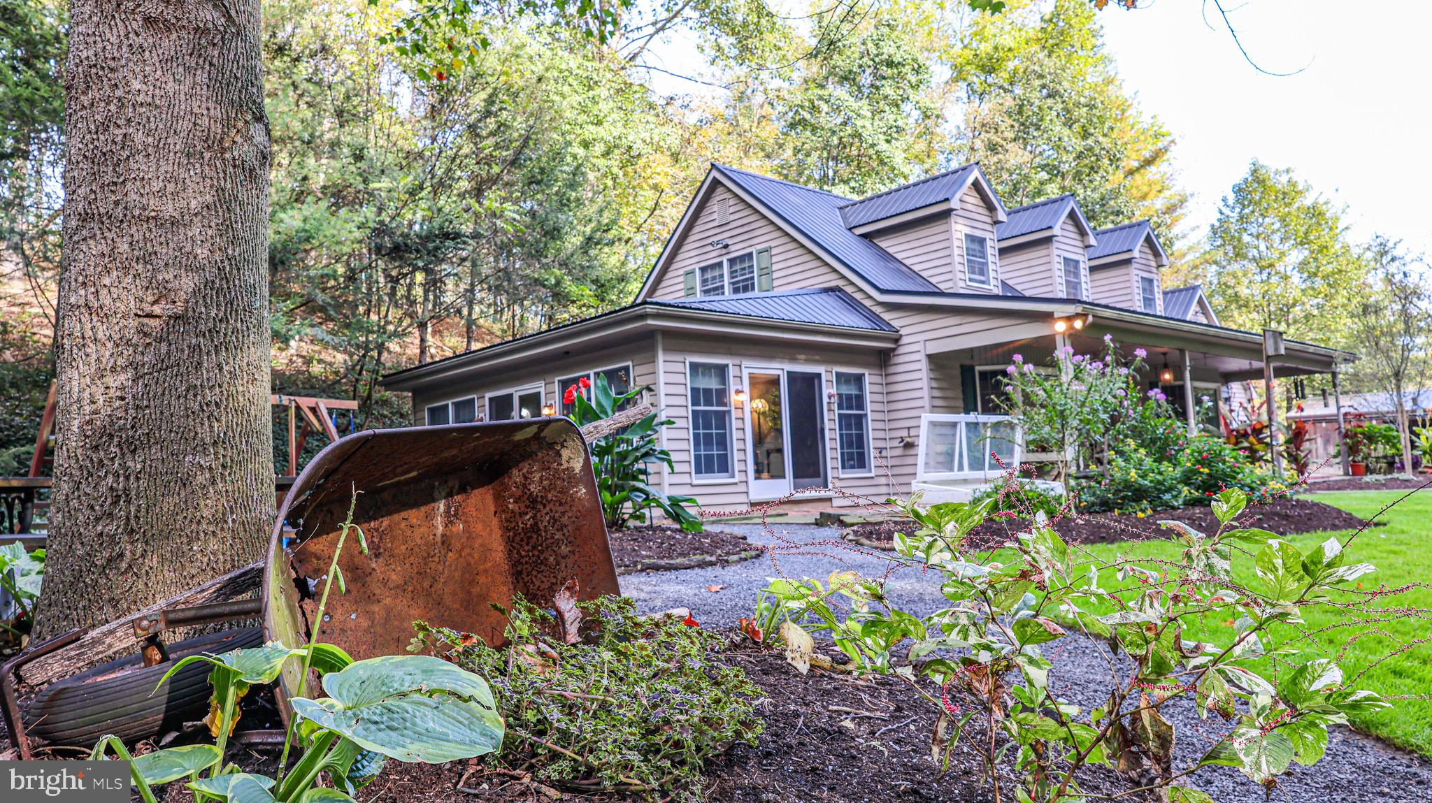 240 Evans Road Lititz, PA 17543 - Photo 54 of 77 front view of house with a yard and potted plants