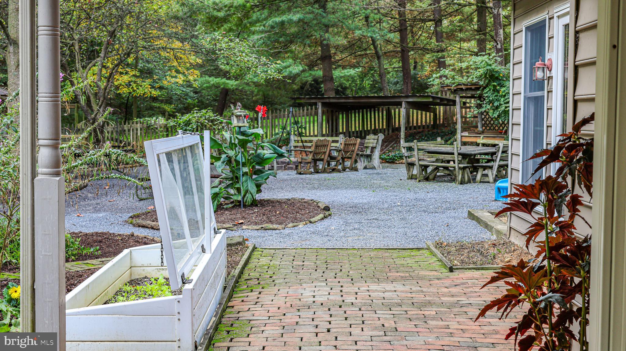 240 Evans Road Lititz, PA 17543 - Photo 57 of 77 a view of an chair and tables in the patio