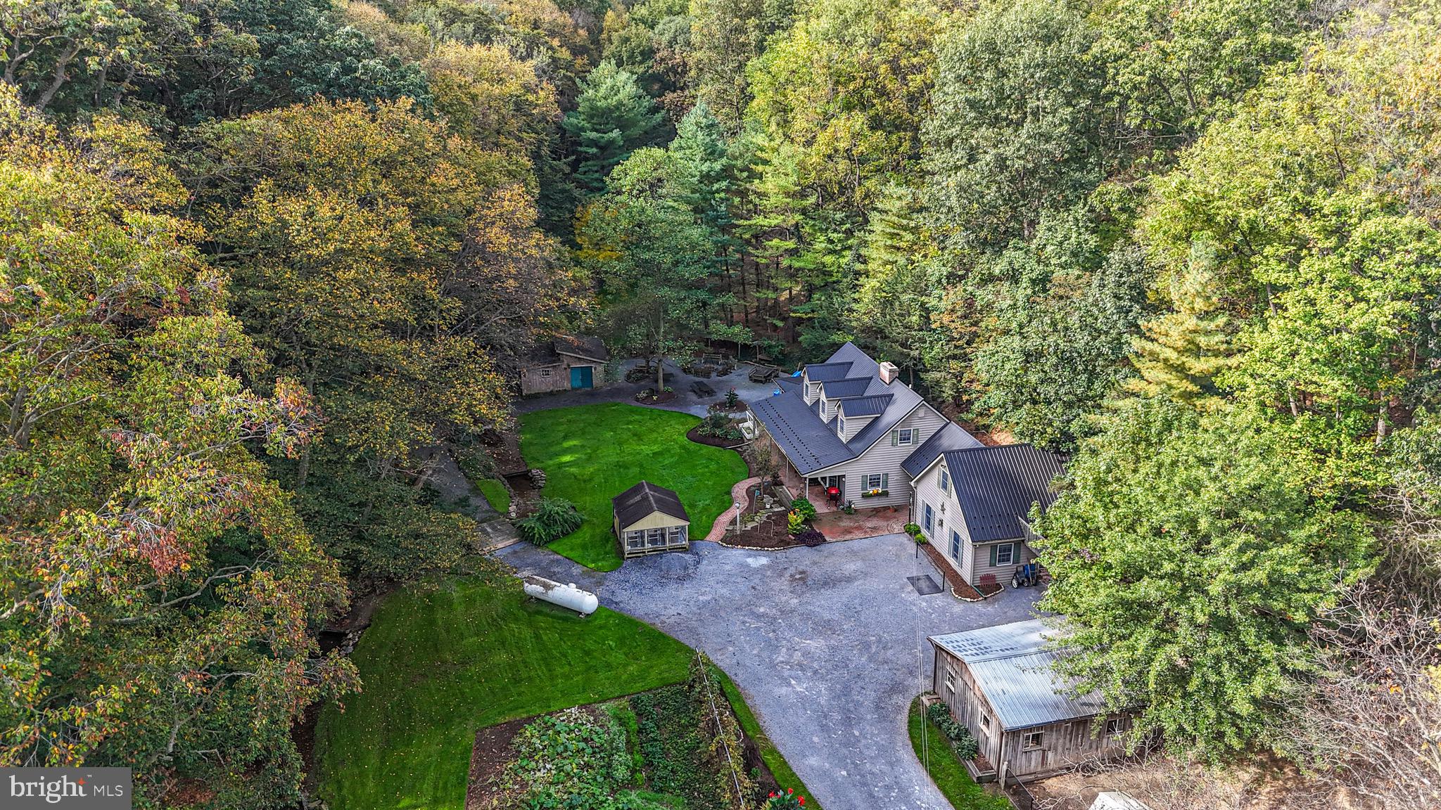 240 Evans Road Lititz, PA 17543 - Photo 68 of 77 an aerial view of a house with garden space and trees