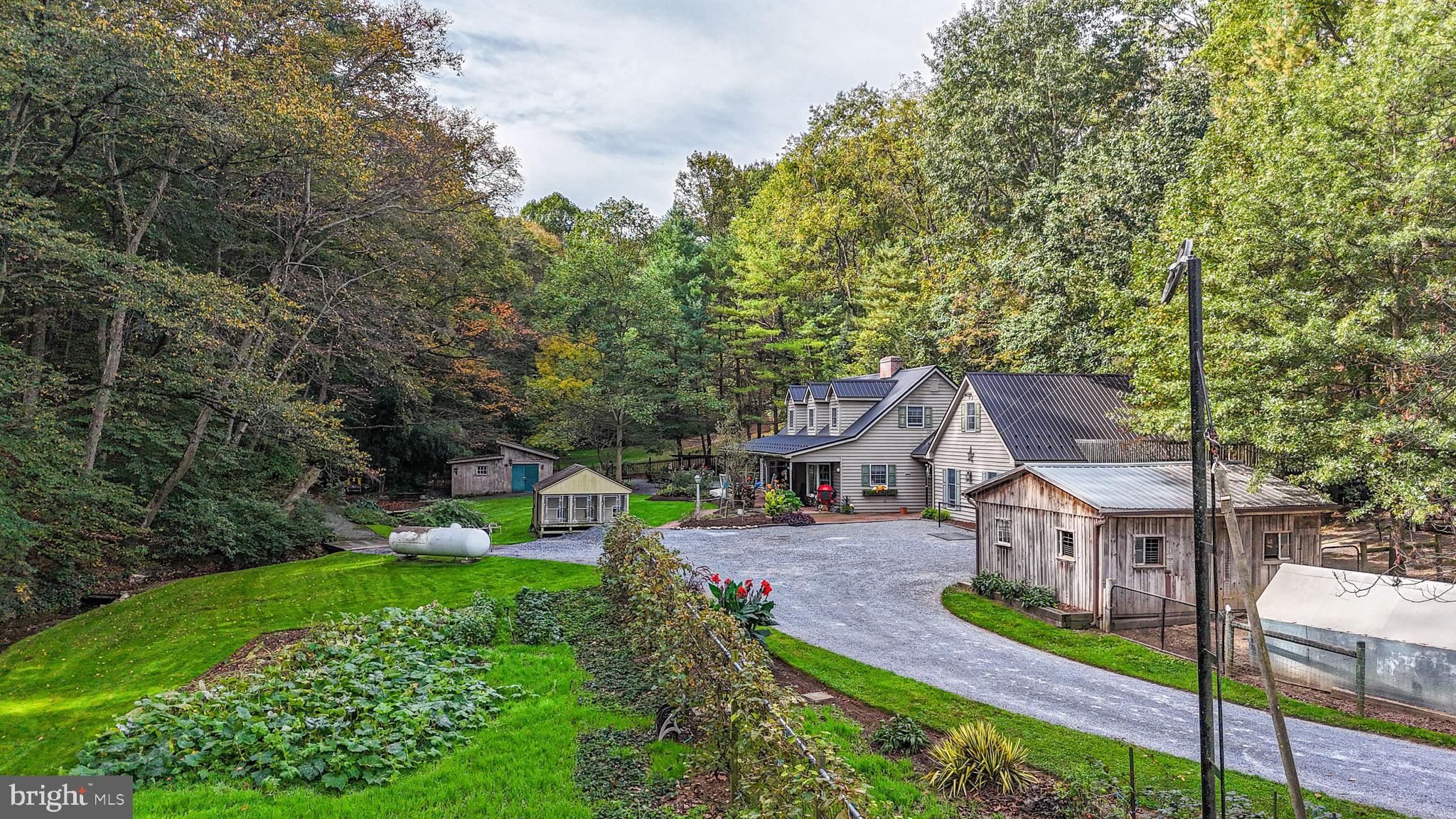240 Evans Road Lititz, PA 17543 - Photo 72 of 77 an aerial view of a house with a big yard potted plants and large tree
