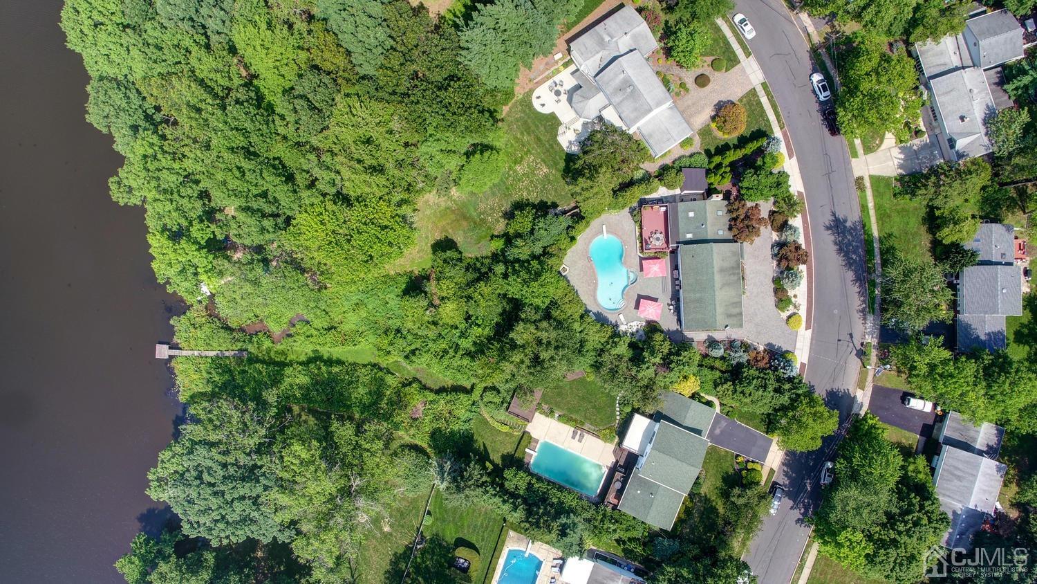 25 Agate Road East Brunswick, NJ 08816 - Photo 3 of 39 an aerial view of a house with a yard and garden
