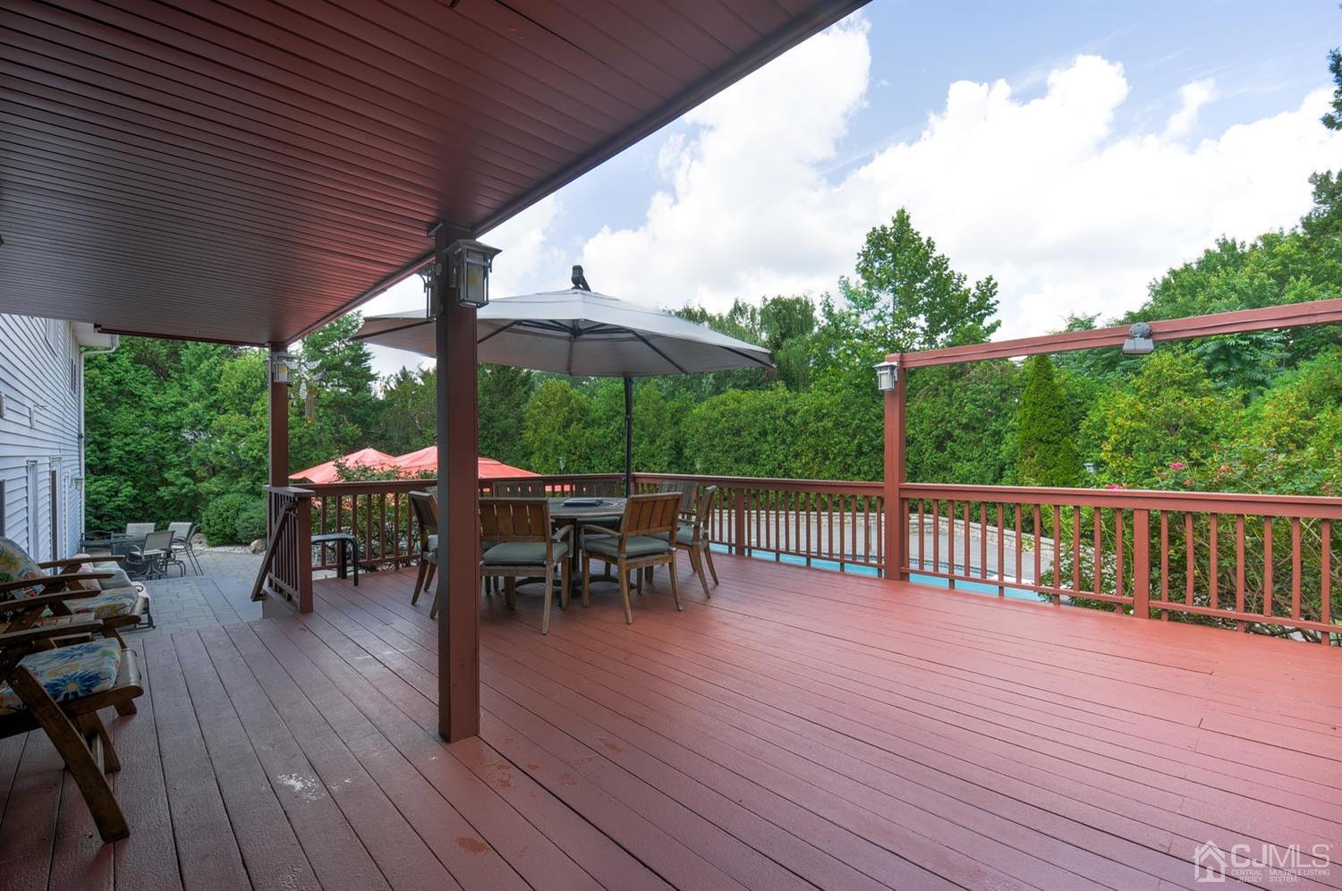 25 Agate Road East Brunswick, NJ 08816 - Photo 35 of 39 a view of a table and chairs on the roof deck