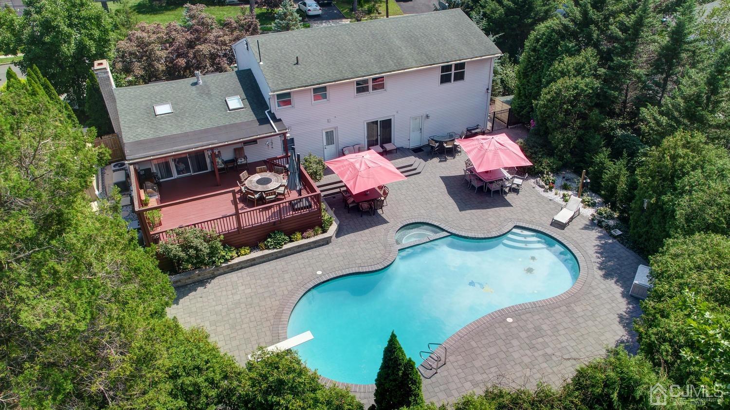 25 Agate Road East Brunswick, NJ 08816 - Photo 39 of 39 an aerial view of a house with a swimming pool