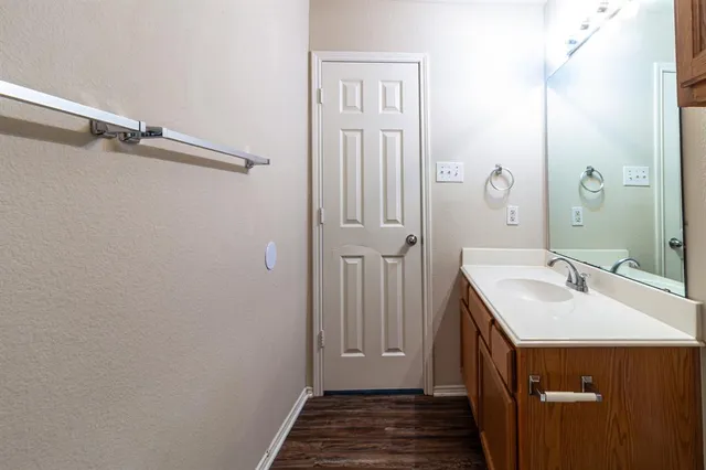 a bathroom with a sink and mirror