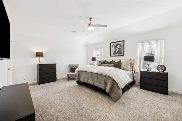 a bathroom with a double vanity sink a mirror and a shower