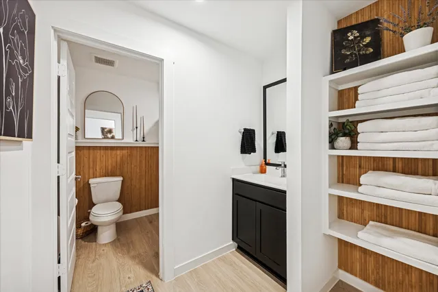 a bathroom with a sink toilet and shower