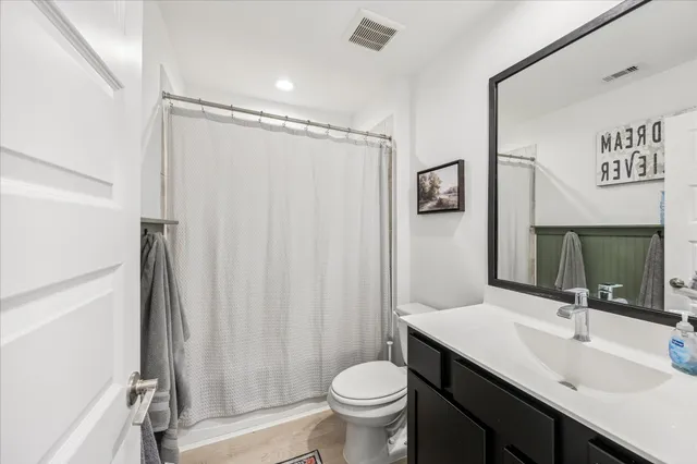 a balcony with seating space and garden view