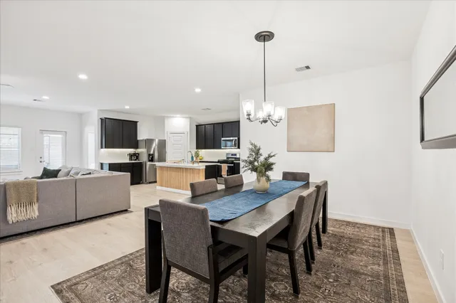 a living room with furniture and flat screen tv