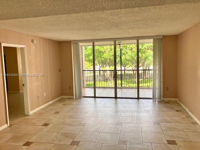 3910 Inverrary Boulevard, Unit 304B Lauderhill, FL 33319 - Photo 12 of 17 a view of an empty room with a window