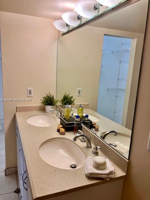 3910 Inverrary Boulevard, Unit 304B Lauderhill, FL 33319 - Photo 12 of 22 a bathroom with a sink and a mirror