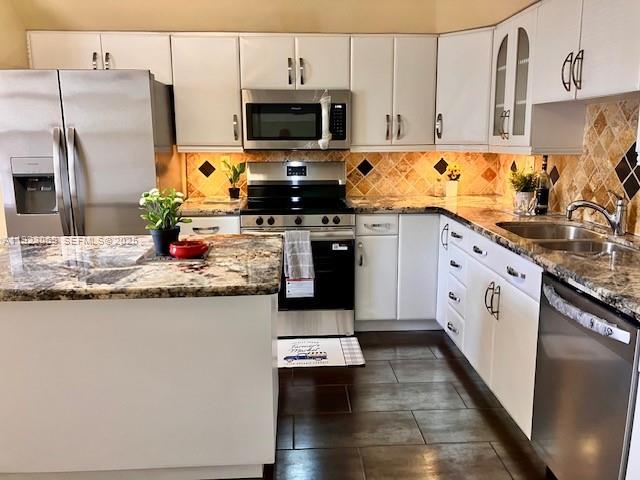 3910 Inverrary Boulevard, Unit 304B Lauderhill, FL 33319 - Photo 16 of 22 a kitchen with granite countertop a refrigerator stove top oven and sink